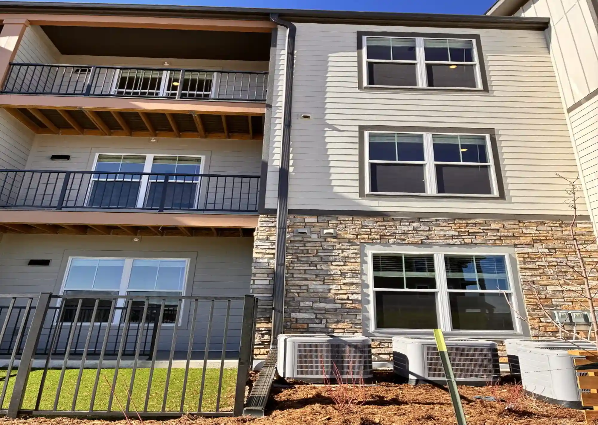 Three-story multifamily gutter system
